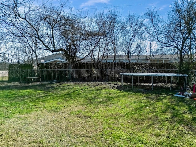 view of yard featuring a trampoline