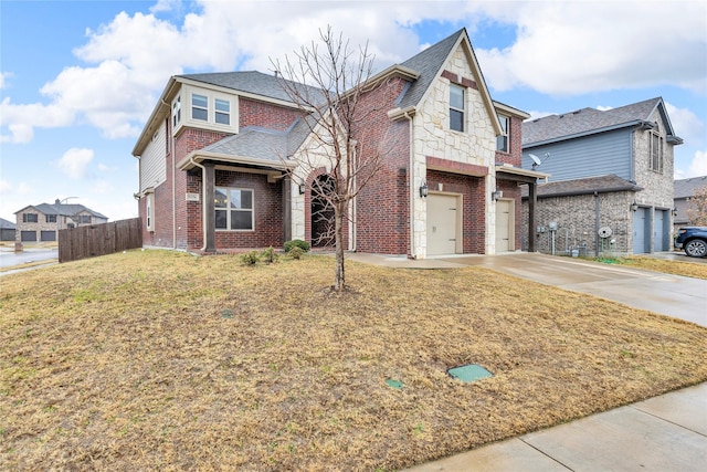 view of front facade with a garage and a front lawn