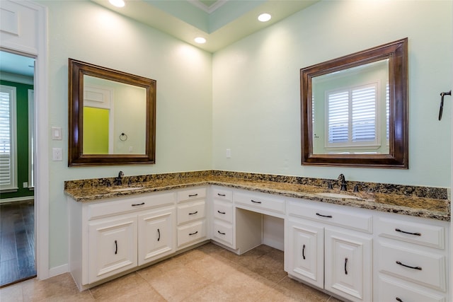 bathroom featuring tile patterned floors and vanity