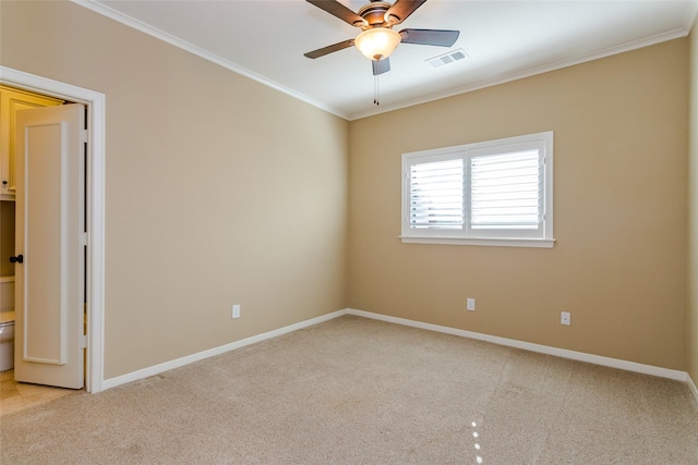 carpeted empty room with ornamental molding and ceiling fan