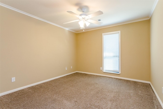 empty room featuring crown molding, ceiling fan, and carpet flooring