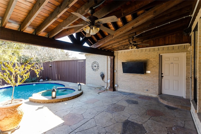 view of swimming pool featuring an in ground hot tub and a patio area