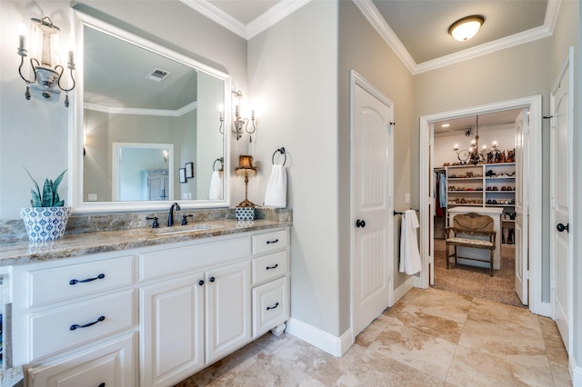 bathroom with ornamental molding and vanity