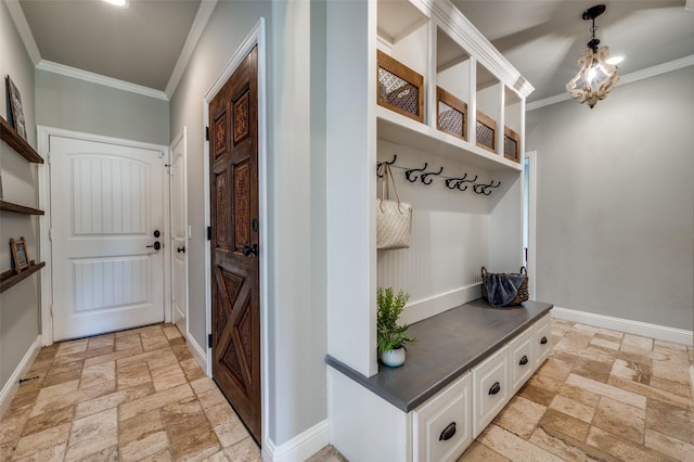 mudroom featuring an inviting chandelier and crown molding