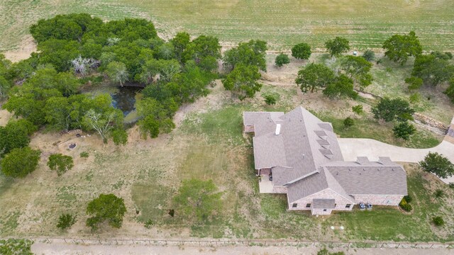 view of front of property with a garage, covered porch, and a front yard