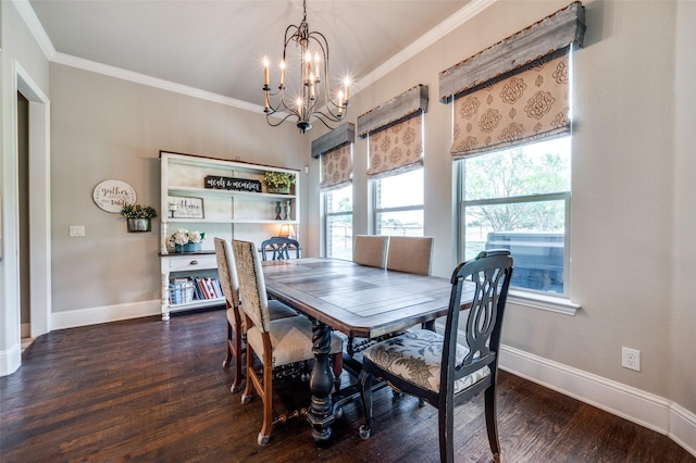 dining area with ornamental molding, dark wood-type flooring, and an inviting chandelier