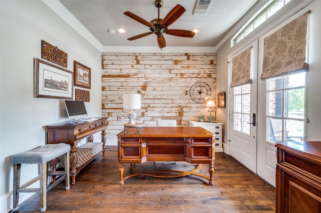 home office with ceiling fan, dark hardwood / wood-style floors, ornamental molding, french doors, and wood walls