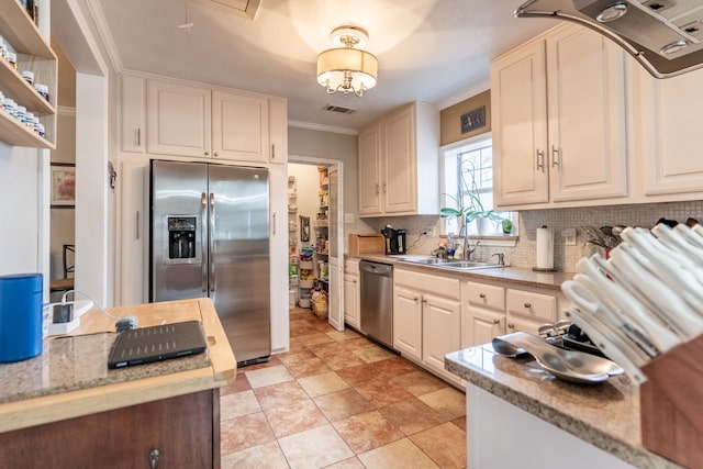 kitchen featuring ornamental molding, stainless steel appliances, sink, and backsplash