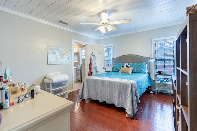 bedroom with dark wood-type flooring, crown molding, and wooden ceiling