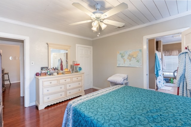 bedroom featuring crown molding, dark wood-type flooring, and ceiling fan