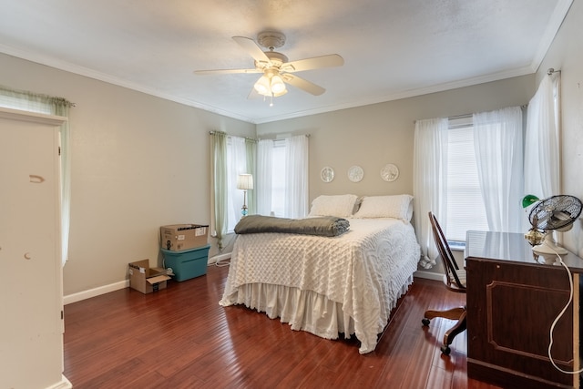 bedroom featuring dark wood-type flooring, ceiling fan, and ornamental molding