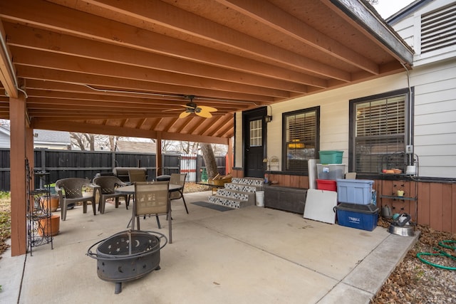 view of patio with a fire pit and ceiling fan