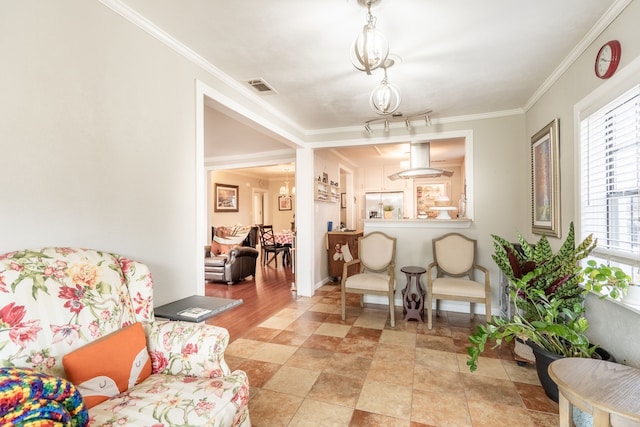 living area featuring crown molding