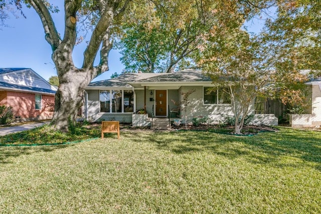 ranch-style home featuring a front yard