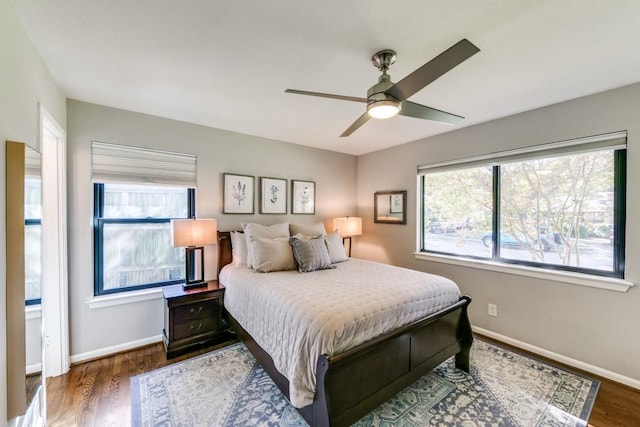 bedroom featuring dark wood-type flooring and ceiling fan