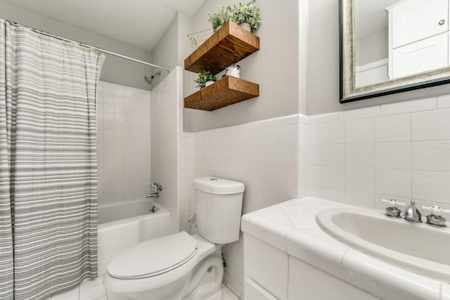 full bathroom with tile walls, vanity, toilet, and shower / bathtub combination with curtain