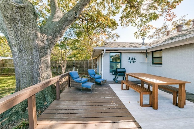 wooden terrace featuring area for grilling