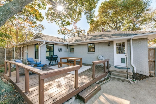 back of house with an outdoor living space and a deck