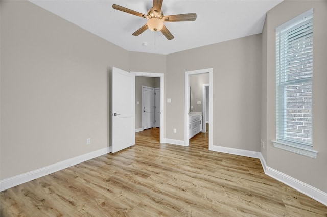 unfurnished bedroom with connected bathroom, light hardwood / wood-style floors, and ceiling fan