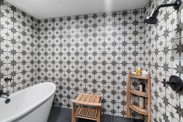 1252 Harmony Cir, Weatherford, TX 76087 - bathroom featuring a freestanding tub and tile walls