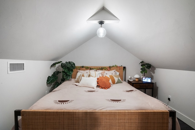 bedroom with vaulted ceiling