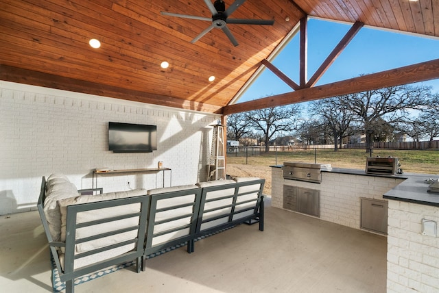 view of patio with area for grilling, exterior kitchen, an outdoor hangout area, ceiling fan, and a gazebo