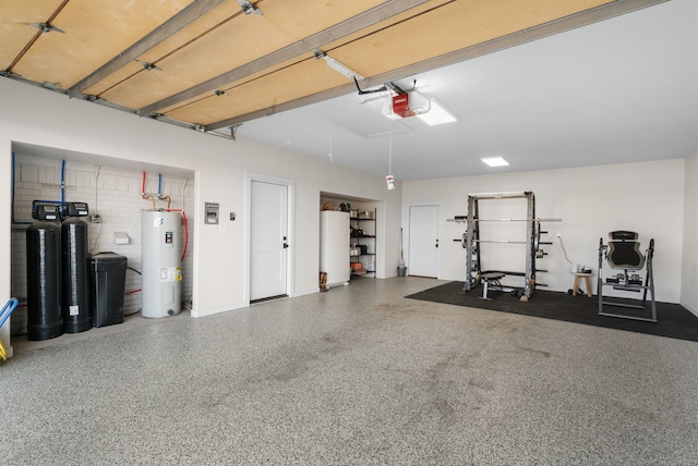 garage featuring a garage door opener, refrigerator, and water heater