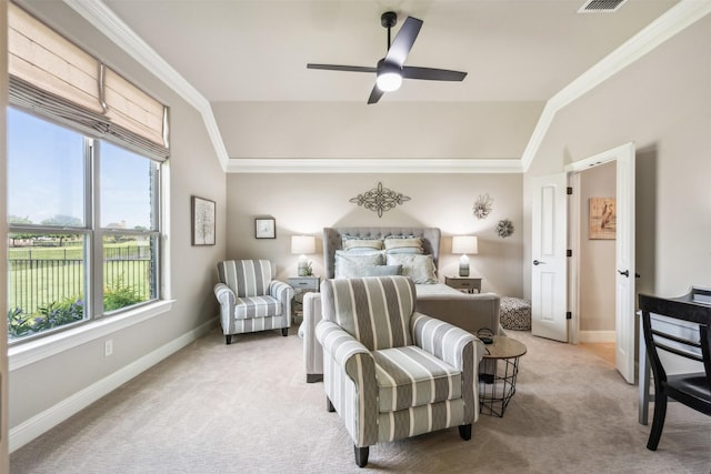 bedroom featuring ornamental molding, vaulted ceiling, light colored carpet, and ceiling fan