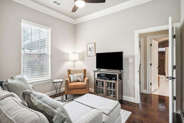 living room with ceiling fan, ornamental molding, dark hardwood / wood-style floors, and a wealth of natural light