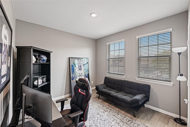 home office with wood-type flooring