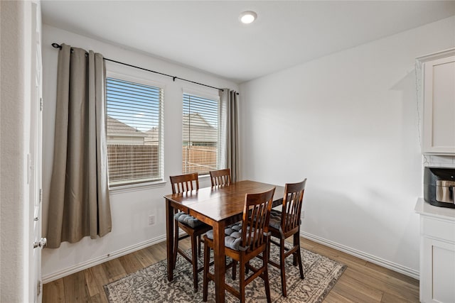 dining area with light hardwood / wood-style floors