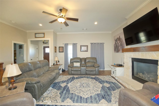 living room featuring hardwood / wood-style flooring, ceiling fan, and ornamental molding