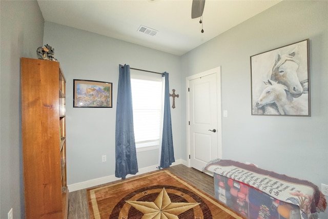 bedroom with ceiling fan and hardwood / wood-style floors