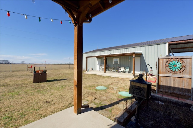 view of yard with a patio area and a rural view