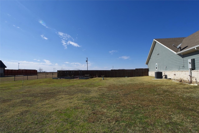 view of yard with central AC