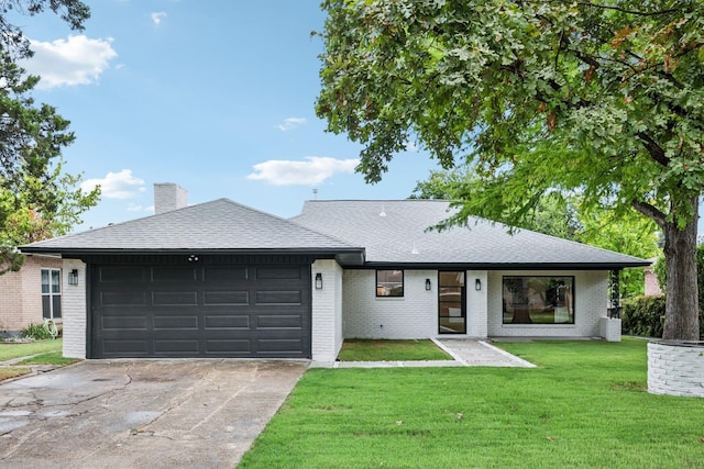 single story home with a garage and a front yard