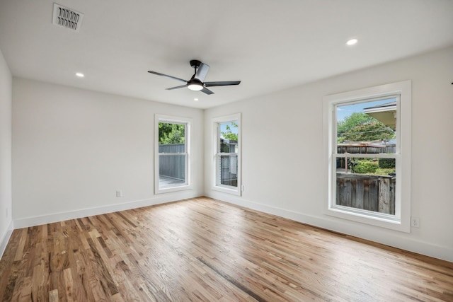 spare room with ceiling fan and light hardwood / wood-style flooring