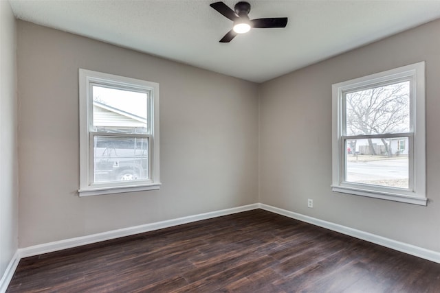 empty room featuring dark hardwood / wood-style floors and ceiling fan