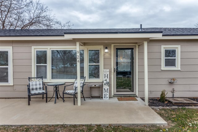 entrance to property with a patio