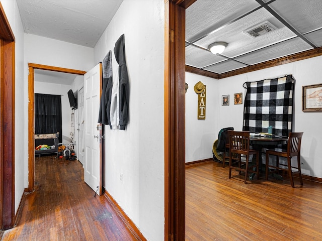 hall with hardwood / wood-style floors