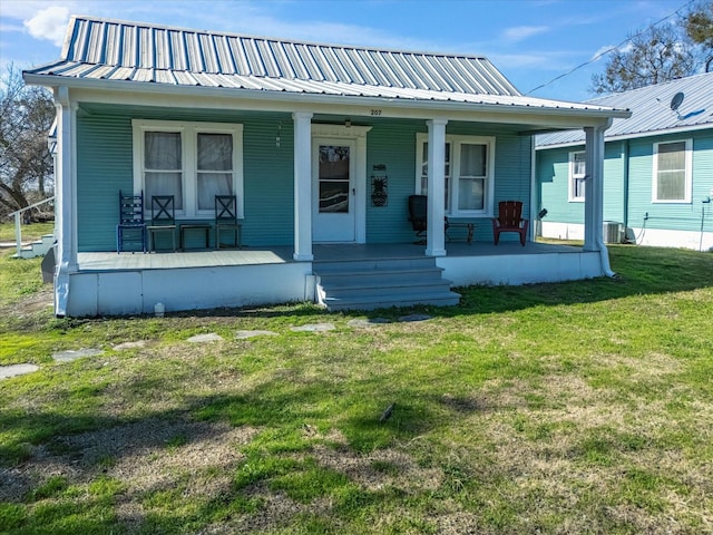 bungalow-style home featuring a porch and a front lawn