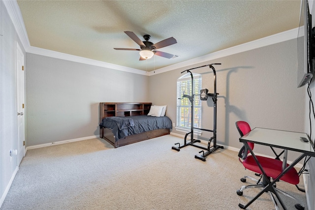 carpeted bedroom with ceiling fan, ornamental molding, and a textured ceiling