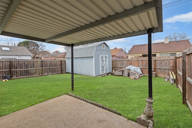 view of yard featuring a storage shed and a patio area