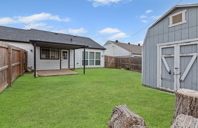 rear view of house with a storage shed, a patio, and a lawn