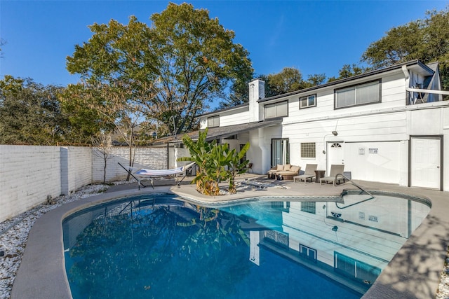 view of swimming pool with a patio area