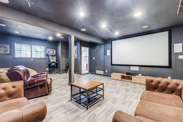 cinema room featuring light hardwood / wood-style flooring