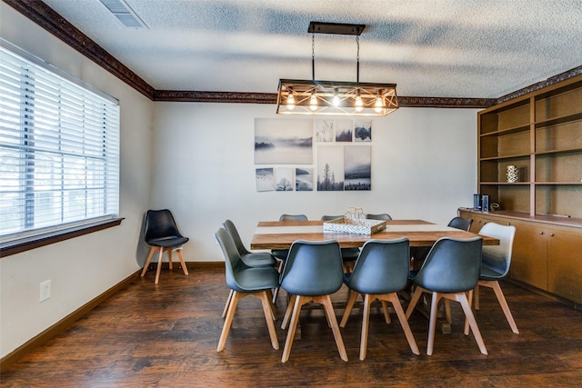 dining room featuring dark hardwood / wood-style flooring, crown molding, and a textured ceiling