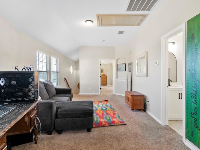 carpeted living room with vaulted ceiling