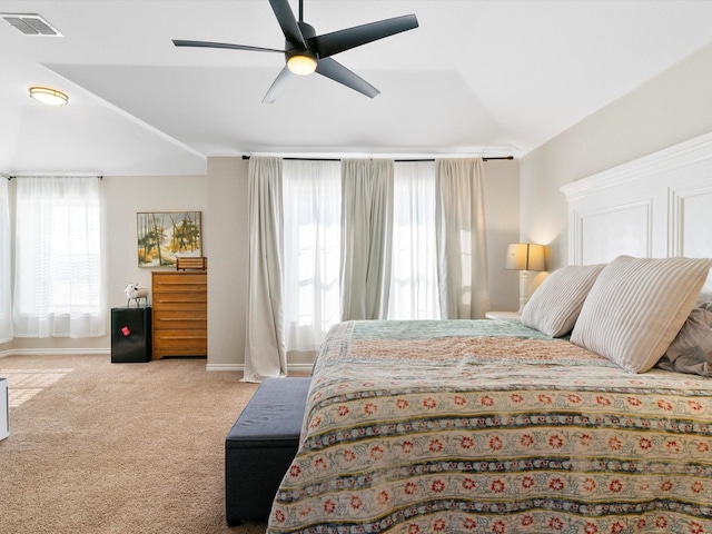 bedroom with light colored carpet and ceiling fan