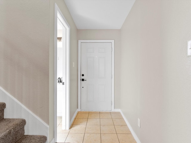 doorway to outside featuring light tile patterned floors